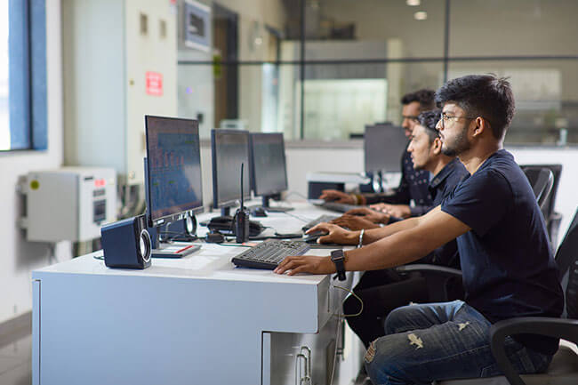 Burakia Colleagues working together on a computer screen